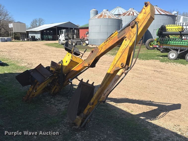 image for item ET1675 Long 1199 A skid steer backhoe