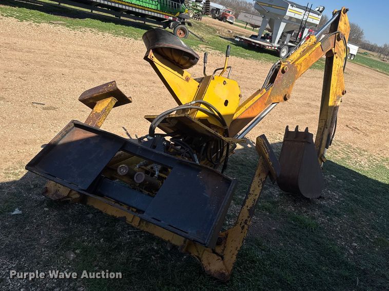 image for item ET1675 Long 1199 A skid steer backhoe