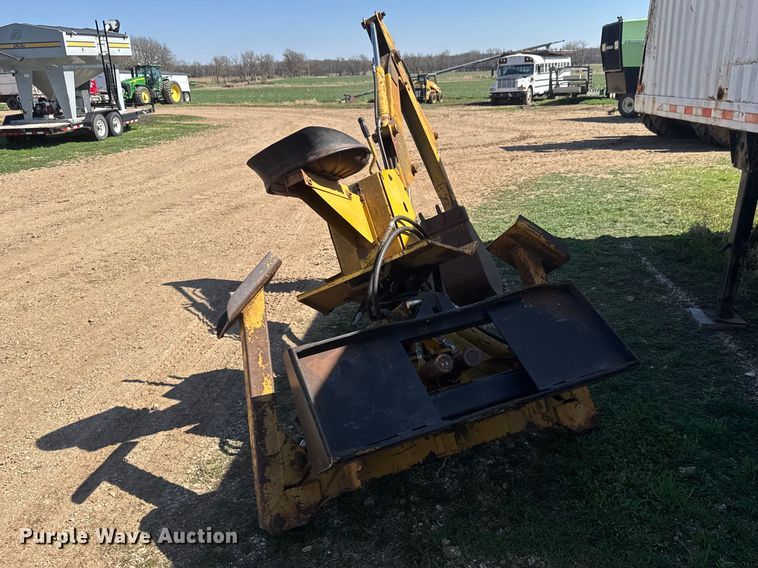 image for item ET1675 Long 1199 A skid steer backhoe
