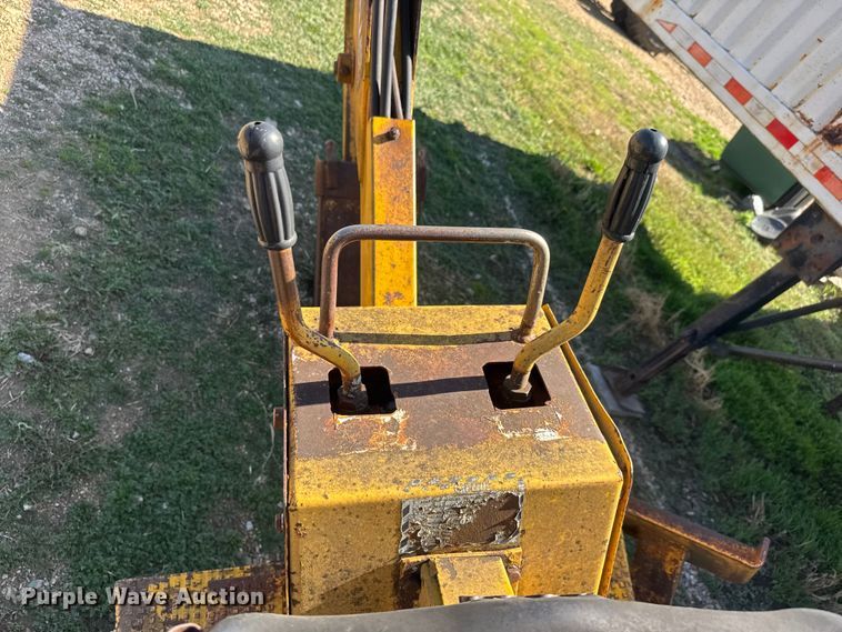 image for item ET1675 Long 1199 A skid steer backhoe