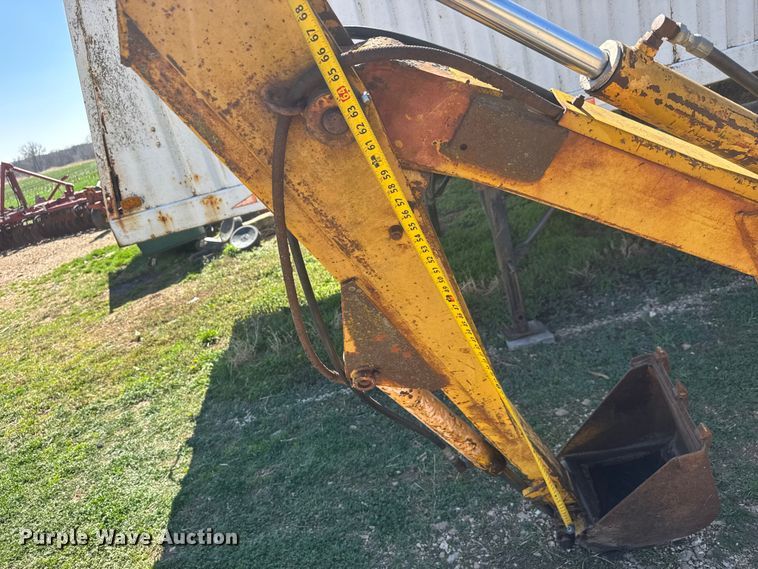 image for item ET1675 Long 1199 A skid steer backhoe