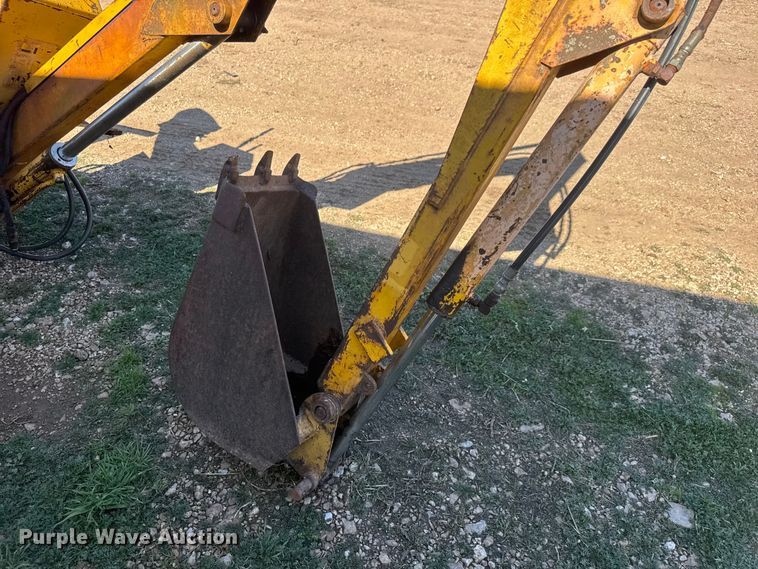 image for item ET1675 Long 1199 A skid steer backhoe