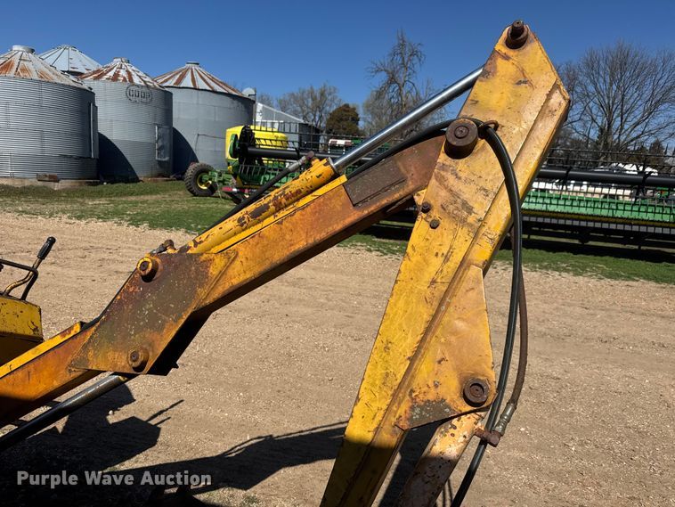 image for item ET1675 Long 1199 A skid steer backhoe