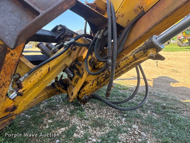 image for item ET1675 Long 1199 A skid steer backhoe