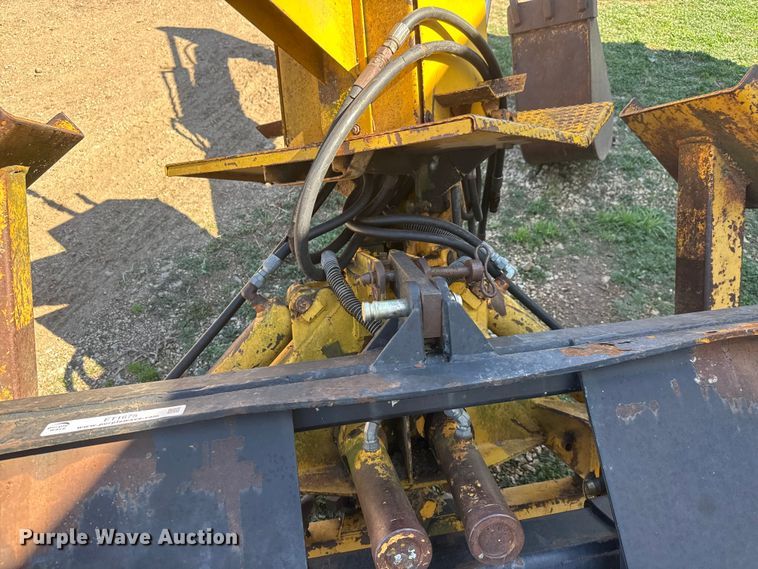 image for item ET1675 Long 1199 A skid steer backhoe