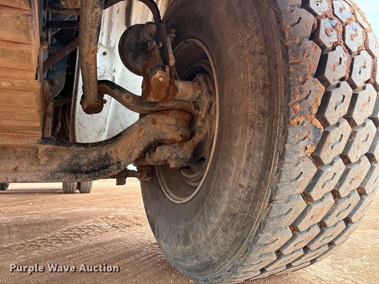 image for item FC2036 2006 Freightliner Business Class M2 flatbed truck with mud mixing truck