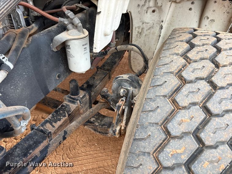 image for item FC2036 2006 Freightliner Business Class M2 flatbed truck with mud mixing truck