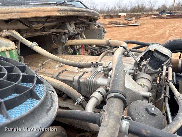 image for item FC2036 2006 Freightliner Business Class M2 flatbed truck with mud mixing truck