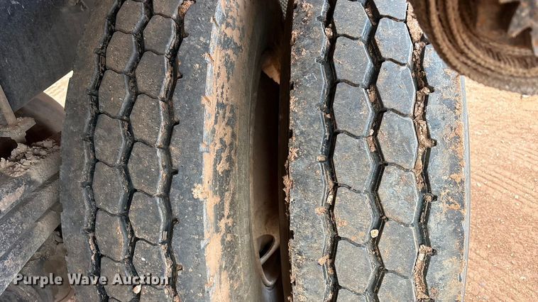 image for item FC2036 2006 Freightliner Business Class M2 flatbed truck with mud mixing truck