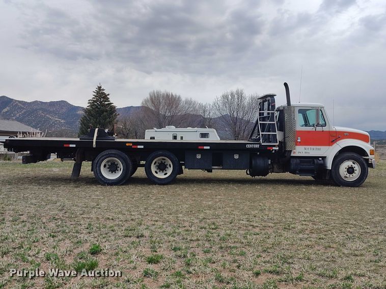 image for item DT0997 1999 International 4900 rollback truck