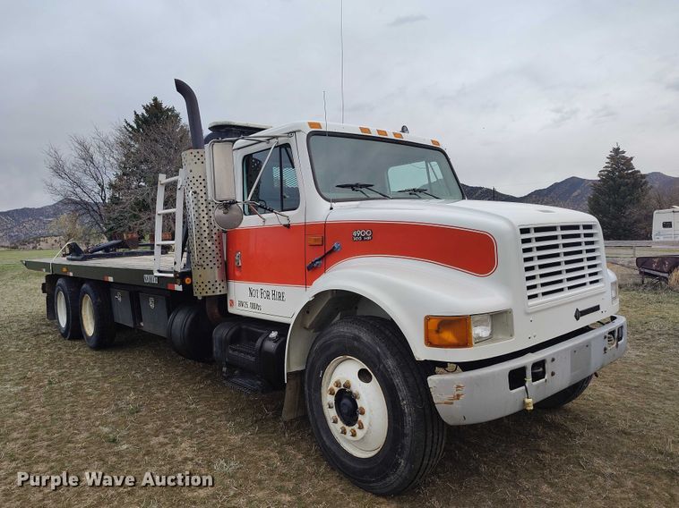 image for item DT0997 1999 International 4900 rollback truck