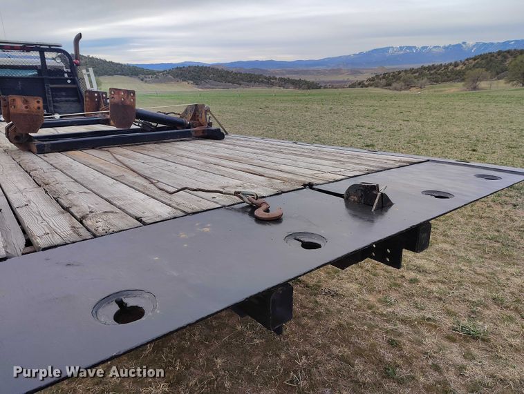 image for item DT0997 1999 International 4900 rollback truck