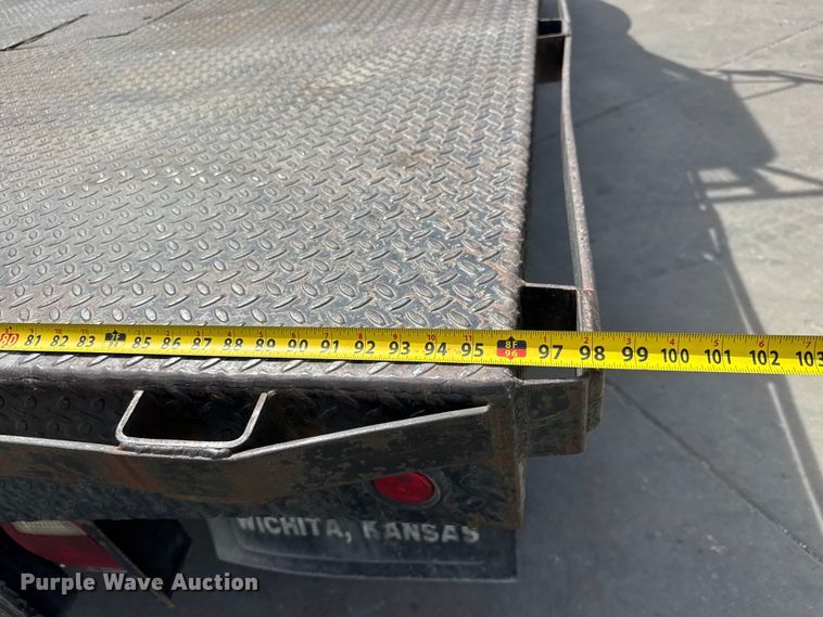 image for item ET1729 2000 International 4700  flatbed truck