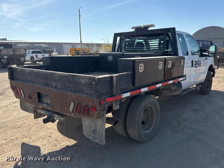image for item ET1814 2011 Ford F350 Super Duty Ext. Cab flatbed pickup truck