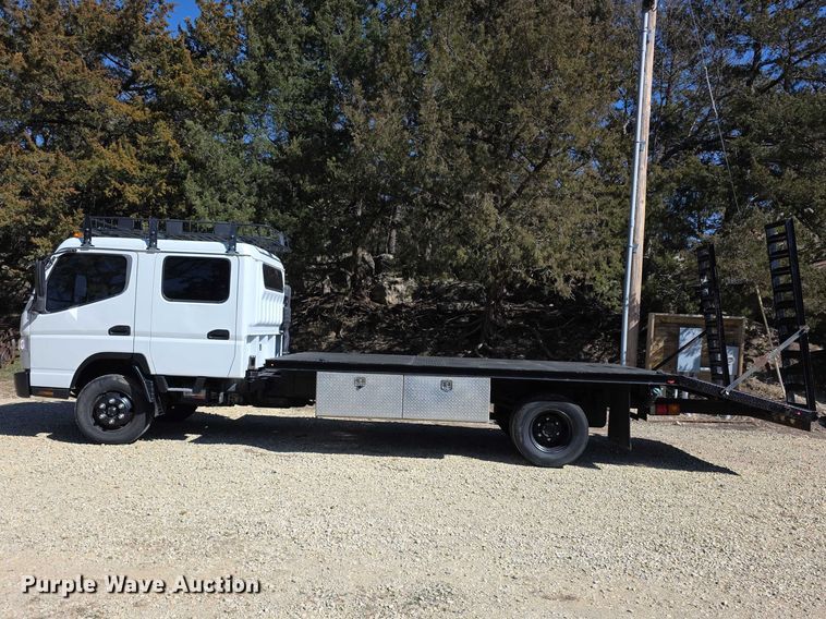 image for item FI0878 2012 Mitsubishi Fuso FE160 Crew Cab flatbed truck