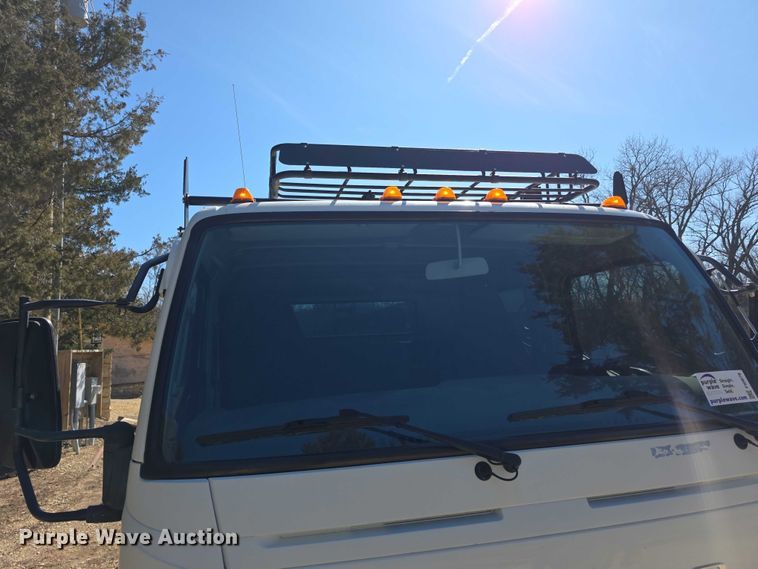 image for item FI0878 2012 Mitsubishi Fuso FE160 Crew Cab flatbed truck