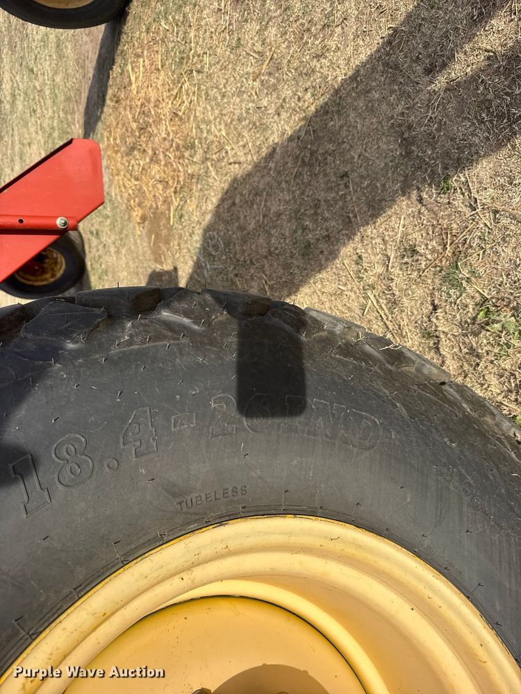 image for item FB7087 2003 New Holland HW320 swather / windrower