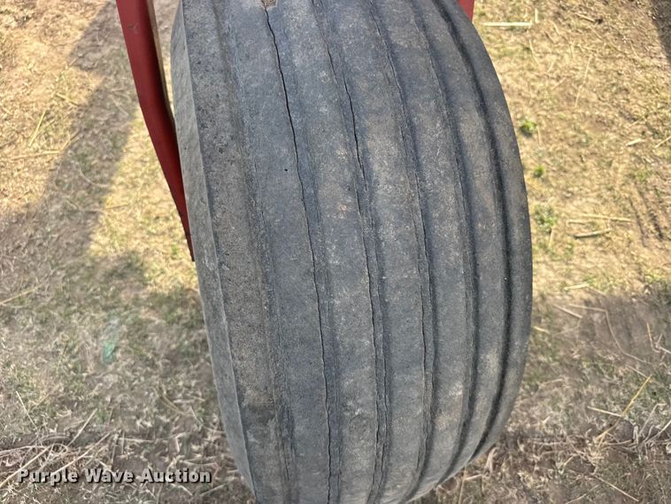 image for item FB7087 2003 New Holland HW320 swather / windrower