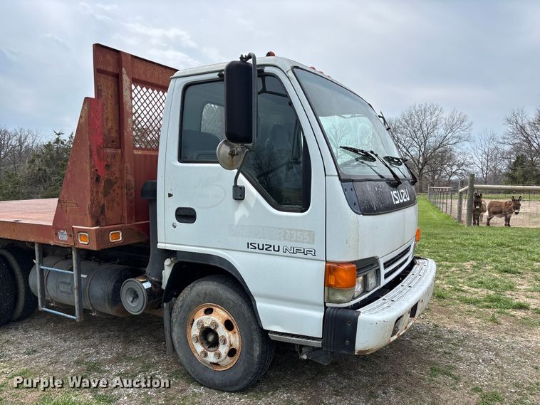 image for item FB3343 1999 Isuzu NPR dump flatbed truck