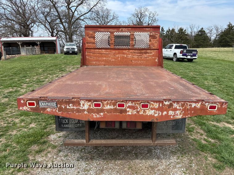 image for item FB3343 1999 Isuzu NPR dump flatbed truck