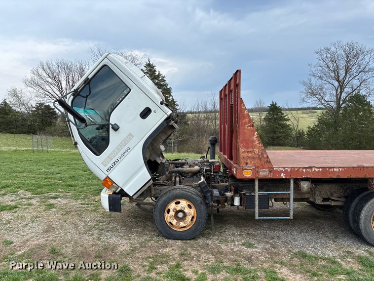 image for item FB3343 1999 Isuzu NPR dump flatbed truck