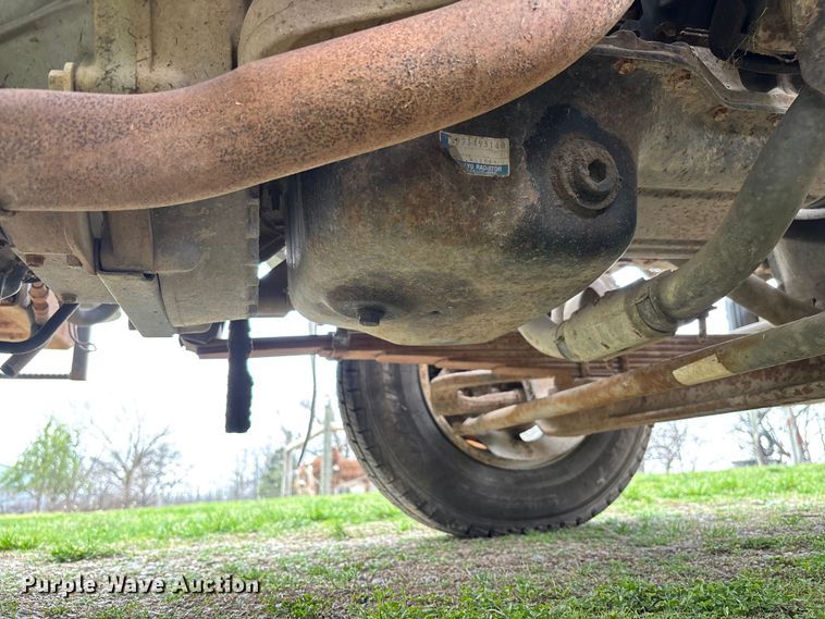 image for item FB3343 1999 Isuzu NPR dump flatbed truck