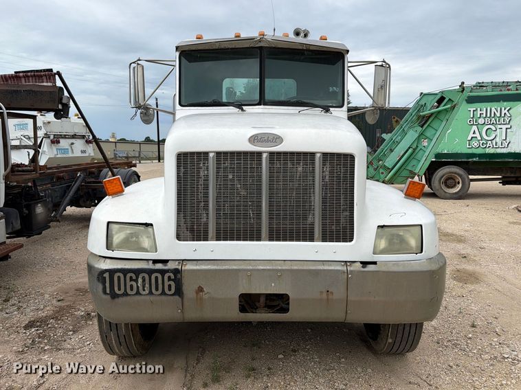 image for item FB8119 1997 Peterbilt 330 dumpster carrier truck
