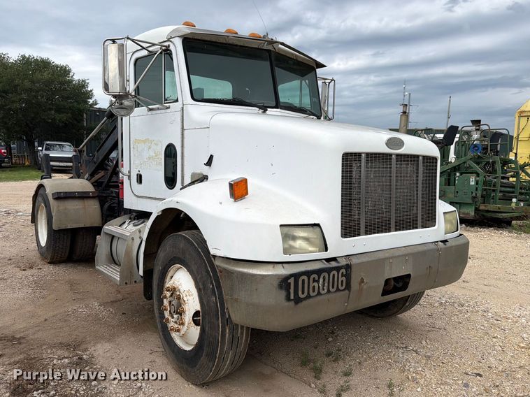image for item FB8119 1997 Peterbilt 330 dumpster carrier truck