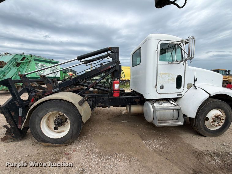 image for item FB8119 1997 Peterbilt 330 dumpster carrier truck