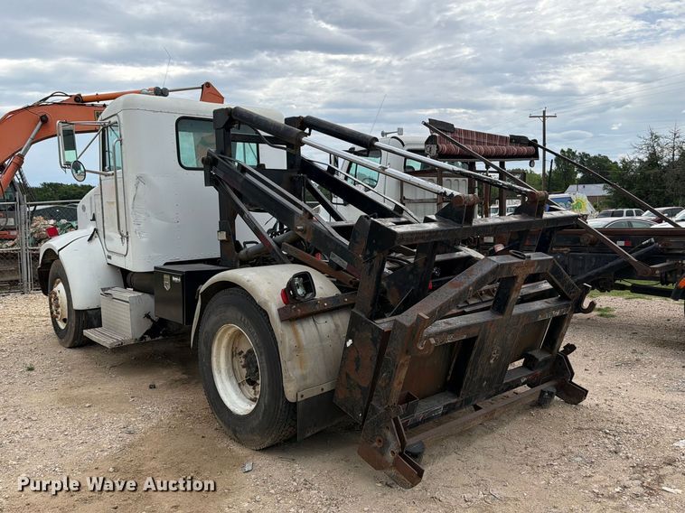 image for item FB8119 1997 Peterbilt 330 dumpster carrier truck