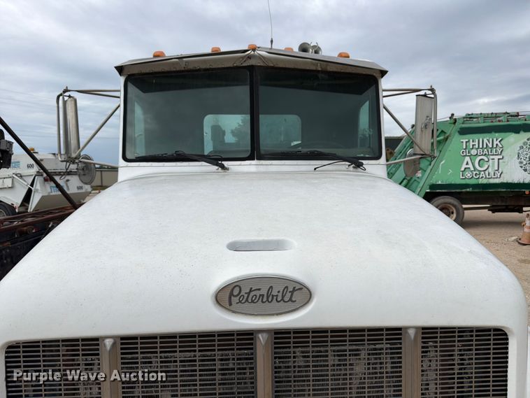 image for item FB8119 1997 Peterbilt 330 dumpster carrier truck