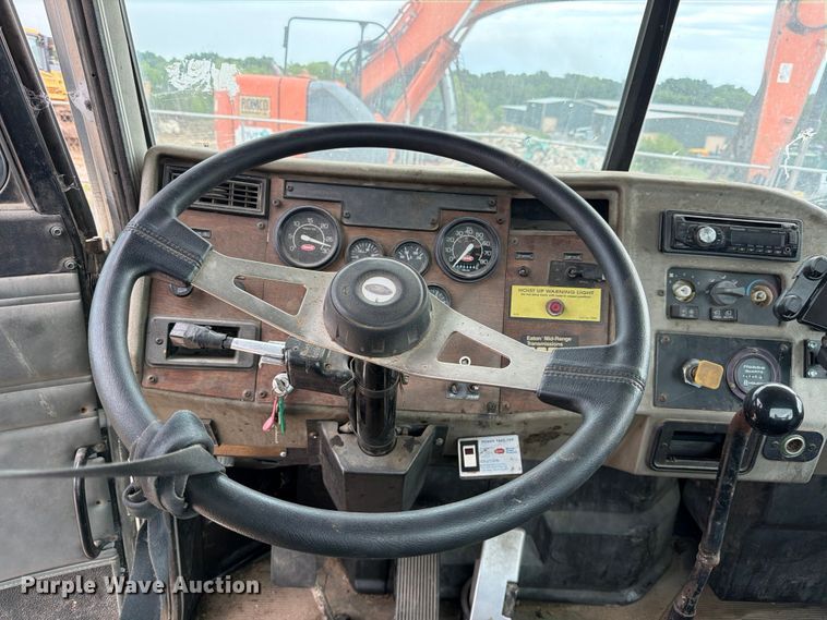 image for item FB8119 1997 Peterbilt 330 dumpster carrier truck