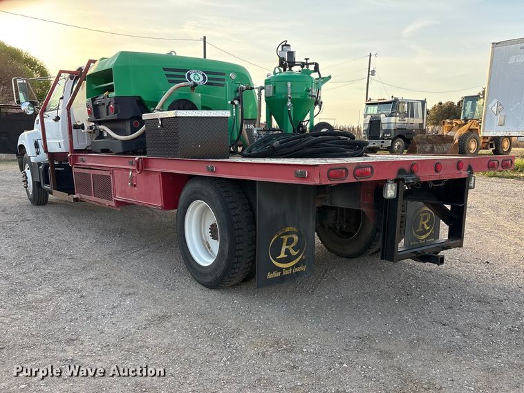 image for item FC2156 1999 GMC C7 flatbed truck