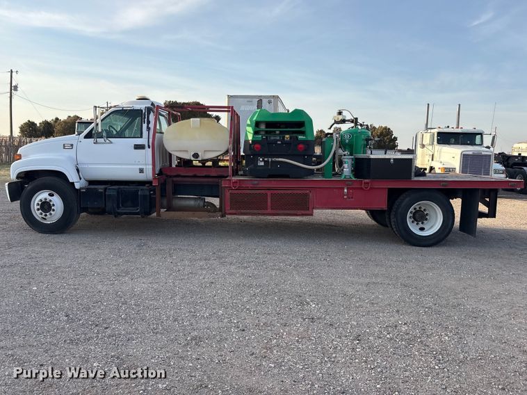 image for item FC2156 1999 GMC C7 flatbed truck