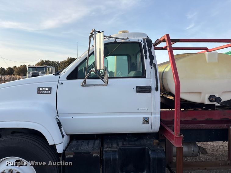 image for item FC2156 1999 GMC C7 flatbed truck