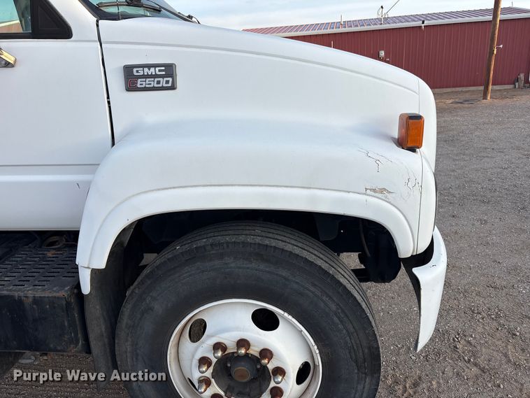 image for item FC2156 1999 GMC C7 flatbed truck