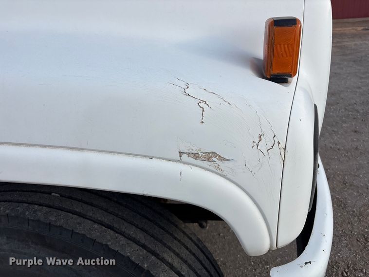 image for item FC2156 1999 GMC C7 flatbed truck