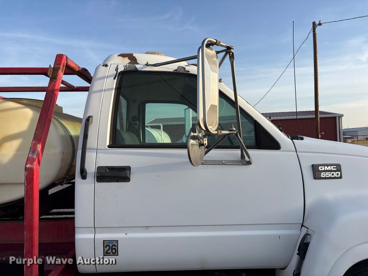 image for item FC2156 1999 GMC C7 flatbed truck