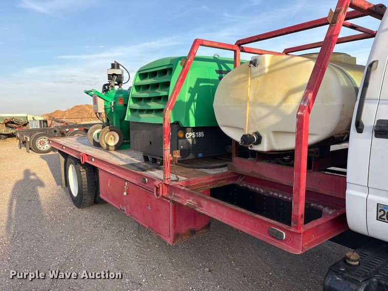 image for item FC2156 1999 GMC C7 flatbed truck