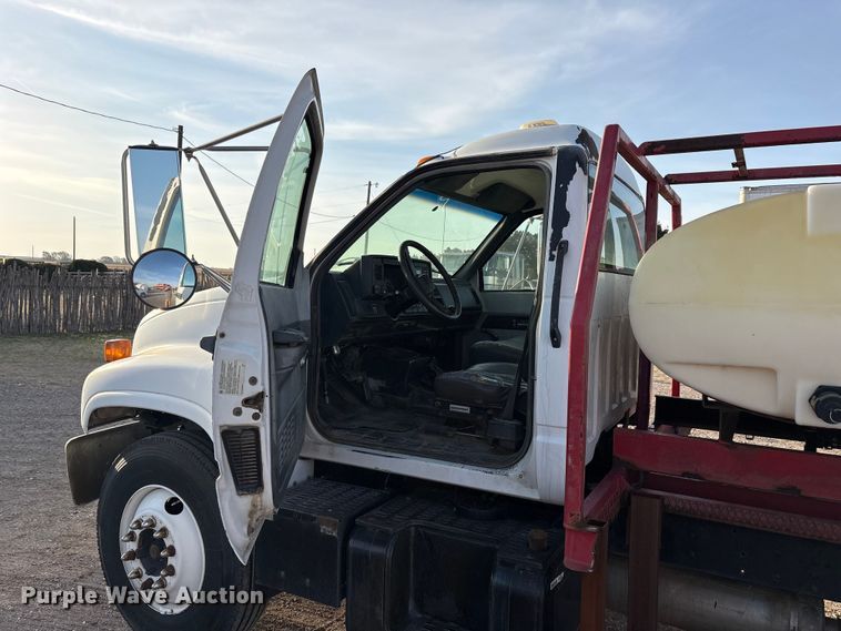 image for item FC2156 1999 GMC C7 flatbed truck