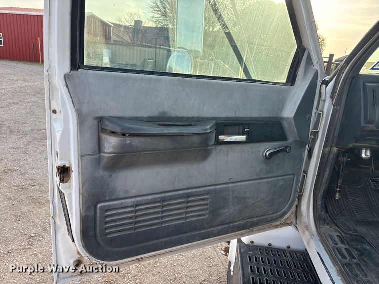 image for item FC2156 1999 GMC C7 flatbed truck