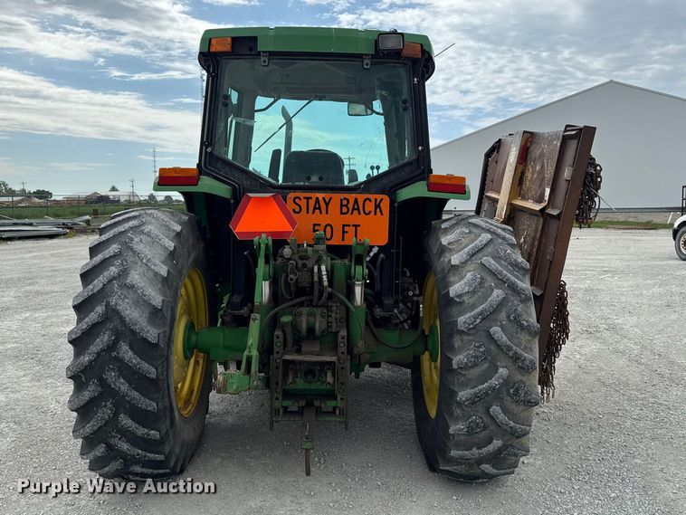image for item EA2342 2001 John Deere 6405 MFWD tractor