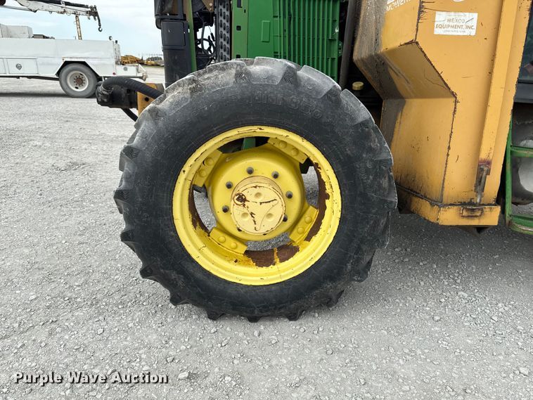 image for item EA2342 2001 John Deere 6405 MFWD tractor