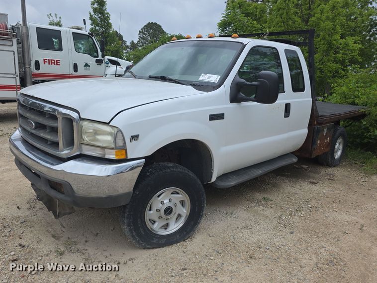 image for item FH6106 2002 Ford F350 Super Duty Ext. Cab flatbed pickup truck