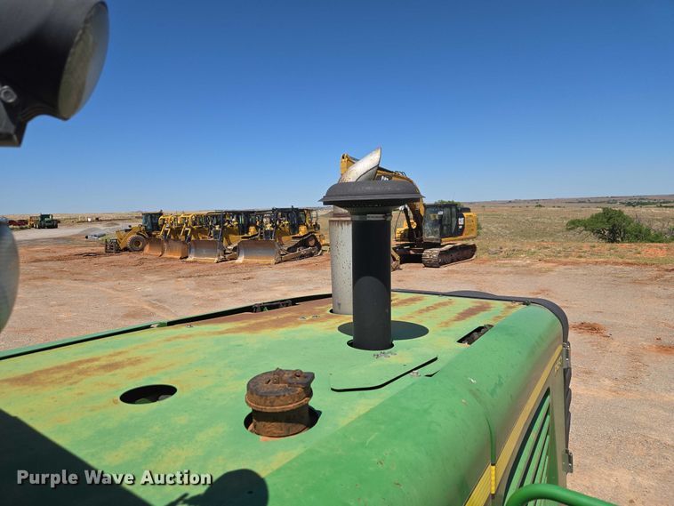 image for item EW0137 2012 John Deere R450 swather / windrower