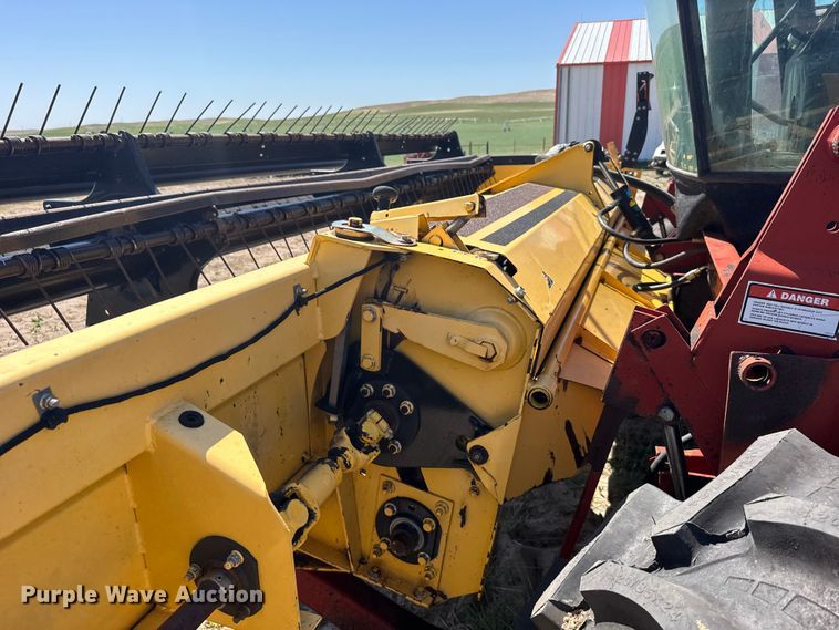 image for item FB7391 1996 Hew Holand 2550 swather / windrower