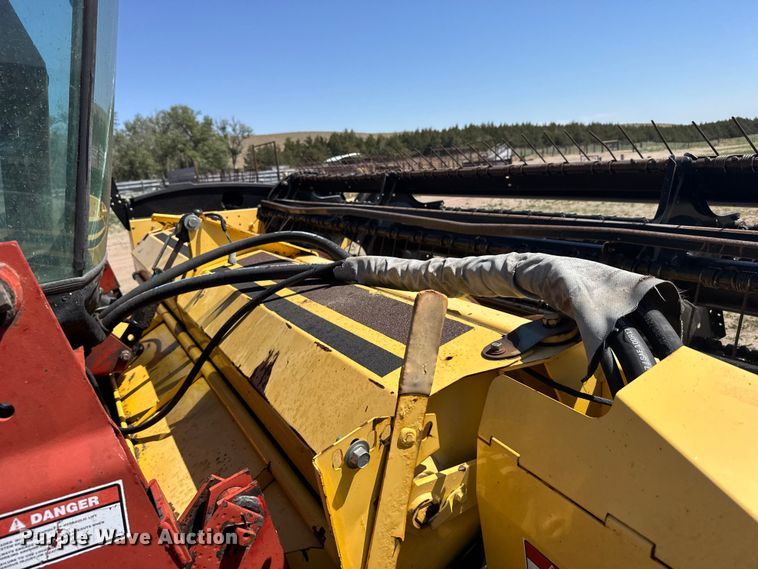 image for item FB7391 1996 Hew Holand 2550 swather / windrower