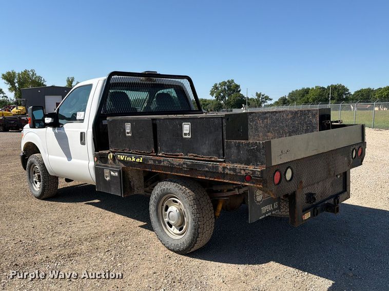 image for item EA4910 2011 Ford F250 Super Duty flatbed pickup truck