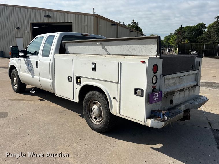 image for item EU5567 2015 Ford F250 Super Duty Ext. Cab flatbed pickup truck