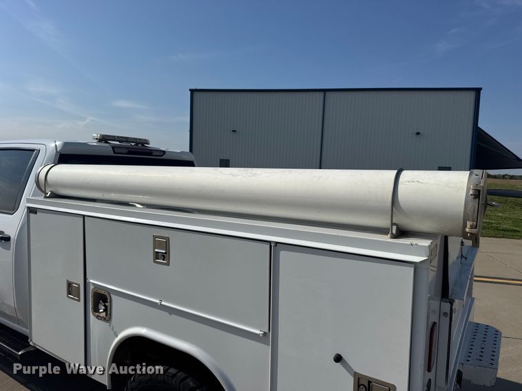 image for item FB7403 2023 GMC Sierra 2500HD Crew Cab utility bed pickup truck